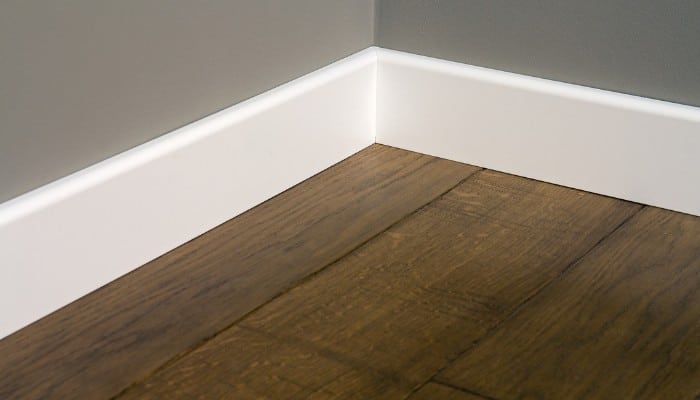 Tall white lacquered skirting